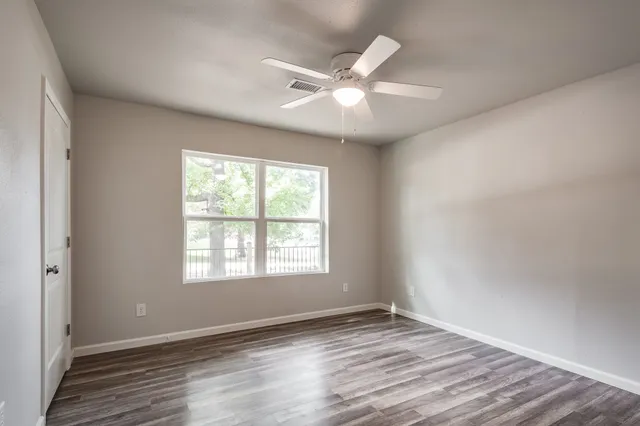 a view of a chairs and table in backyard