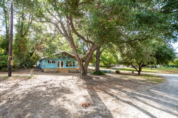 a view of a house with swimming pool and sitting area
