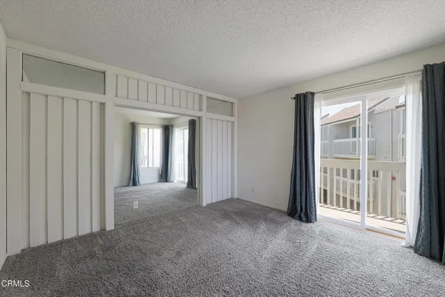 a view of a room with a balcony