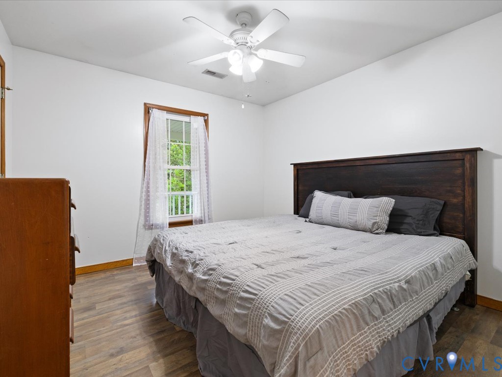3695 Three Chopt Road Gum Spring, VA 23065 - Photo 24 of 55 Bedroom featuring wood-finish flooring, a white ce