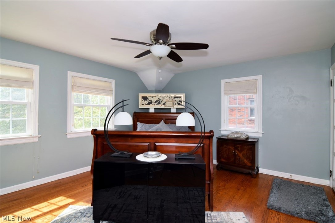 3451 Edison Road Cleveland Heights, OH 44121 - Photo 25 of 46 Hardwood flooring, multiple windows with natural light, ceiling fan with integrated lighting, painted walls, and white trim