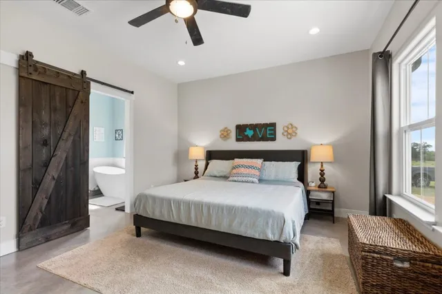 a bedroom with a bed closet and a window