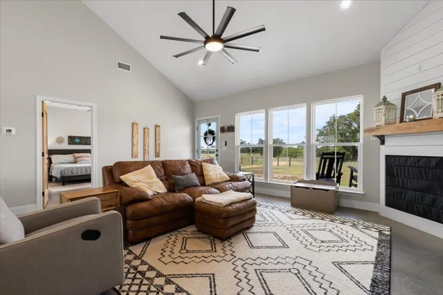 a living room with furniture and a large window