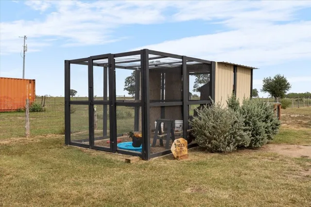a view of a house with backyard and porch