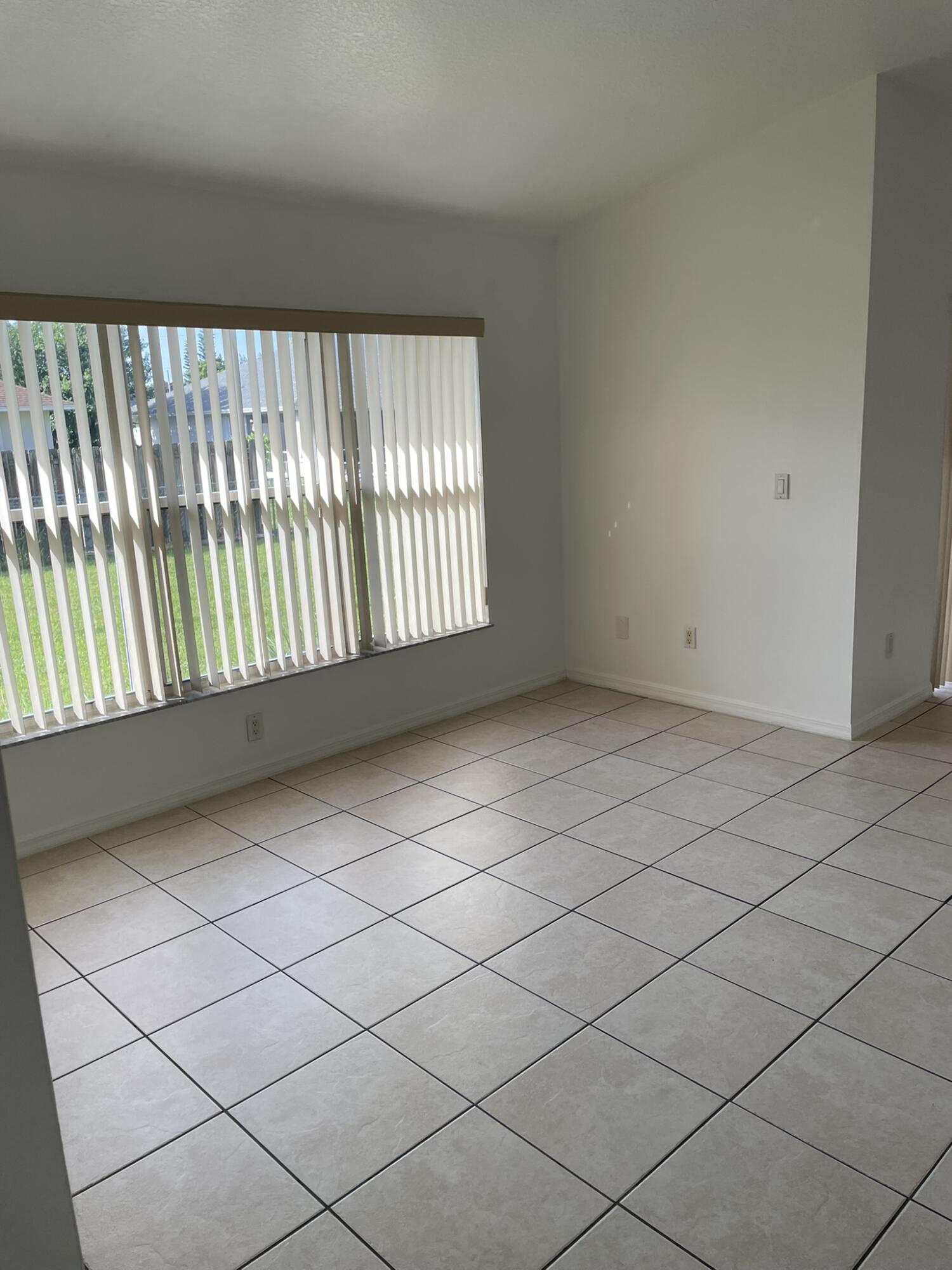 4448 Northwest Bighorn Avenue Port St. Lucie, FL 34983 - Photo 18 of 19 a view of an empty room and window