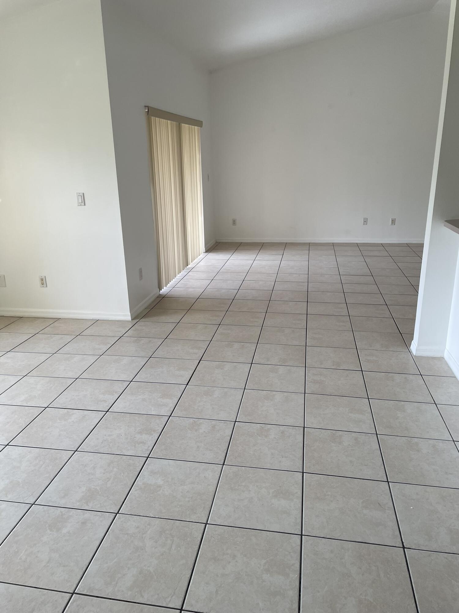 4448 Northwest Bighorn Avenue Port St. Lucie, FL 34983 - Photo 19 of 19 a view of an empty room with a window