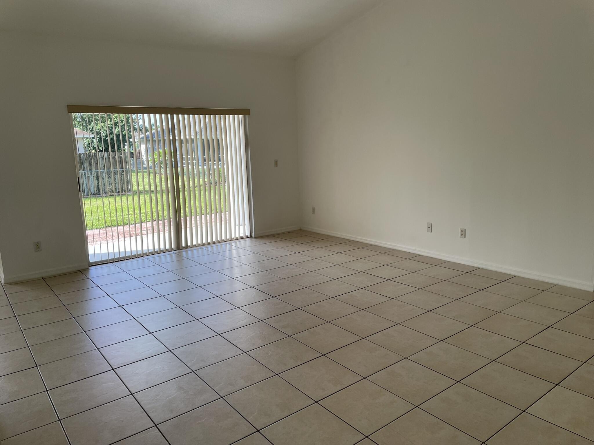 4448 Northwest Bighorn Avenue Port St. Lucie, FL 34983 - Photo 4 of 19 a view of an empty room with a window