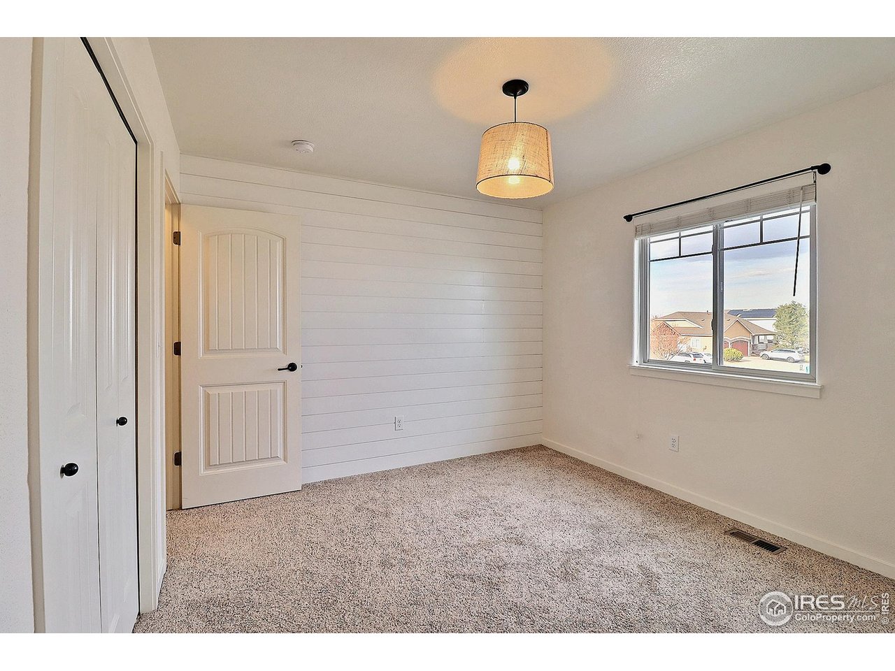 360 Bluegrass Street Eaton, CO 80615 - Photo 23 of 32 a view of an empty room with a window