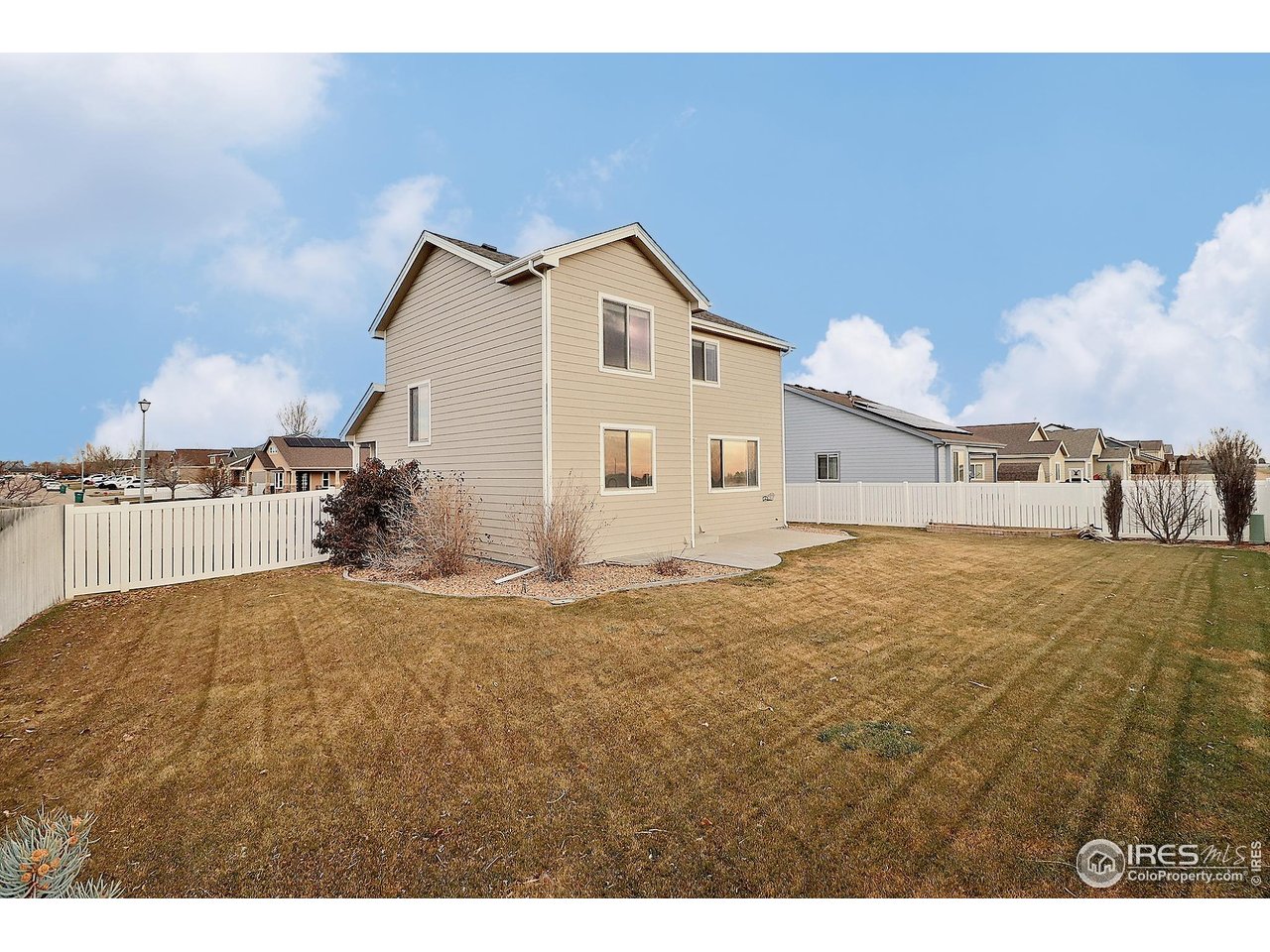 360 Bluegrass Street Eaton, CO 80615 - Photo 30 of 32 a view of a kitchen with kitchen island in the background