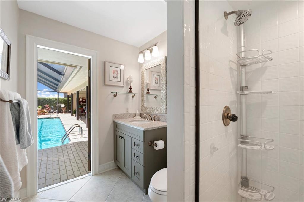 2209 Regal Way Naples, FL 34110 - Photo 17 of 24 a bathroom with a sink a toilet and shower