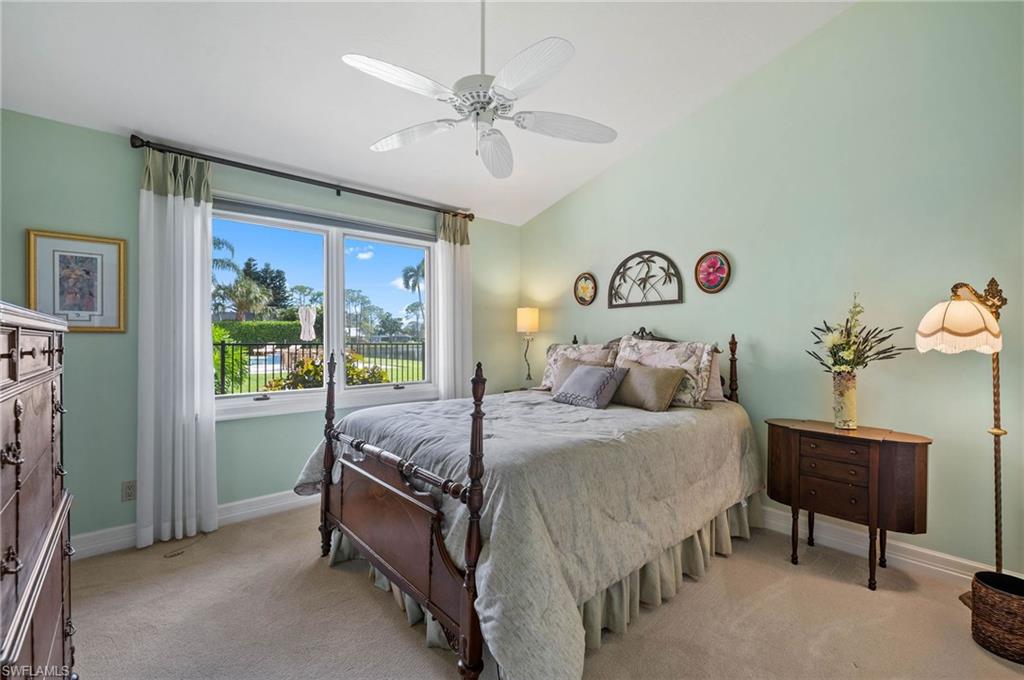 2209 Regal Way Naples, FL 34110 - Photo 18 of 24 a bed room with a bed and a window