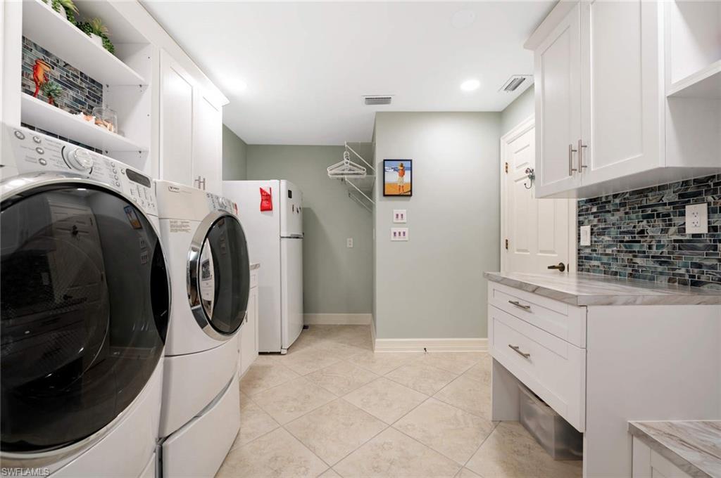 2209 Regal Way Naples, FL 34110 - Photo 20 of 24 a utility room with dryer and washer