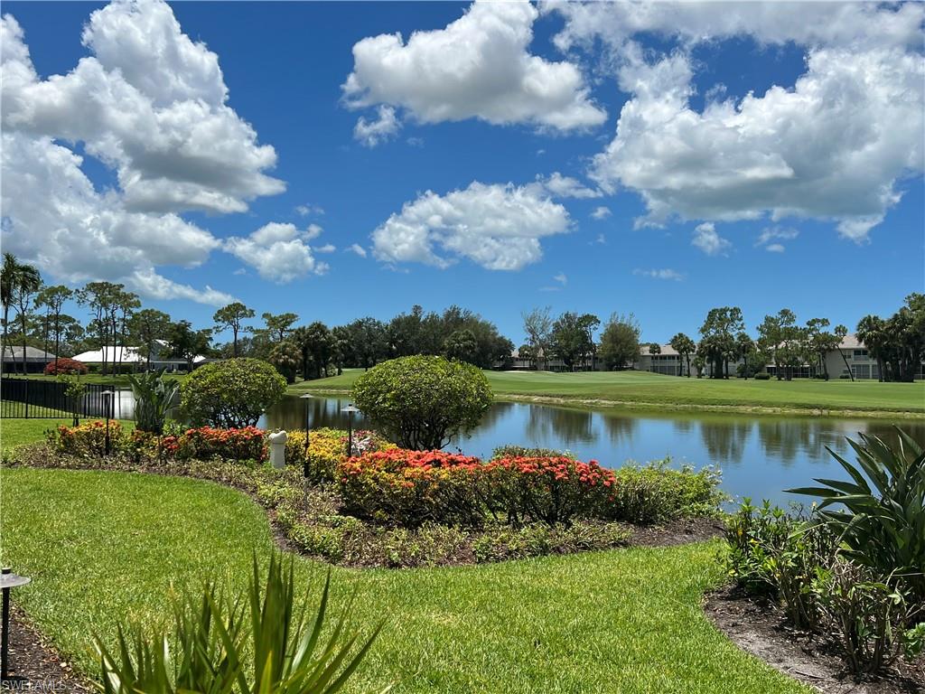 2209 Regal Way Naples, FL 34110 - Photo 4 of 24 a view of a lake with a city