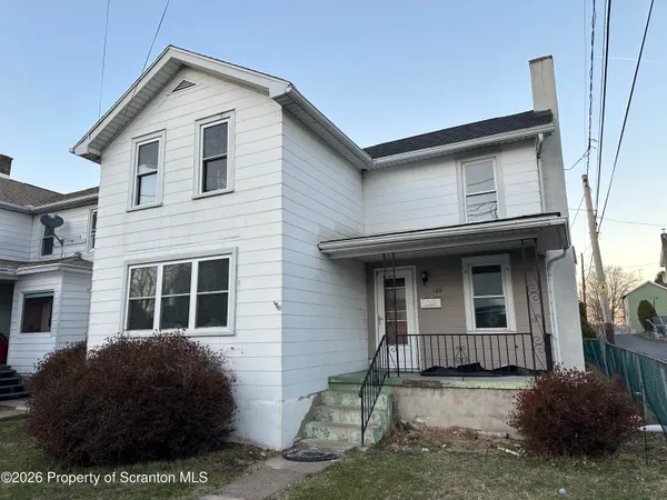 a house that has a window in front of it