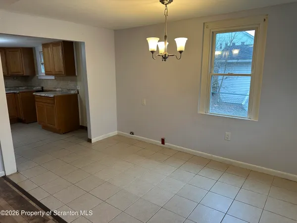 a view of kitchen with granite countertop cabinets and stainless steel appliances