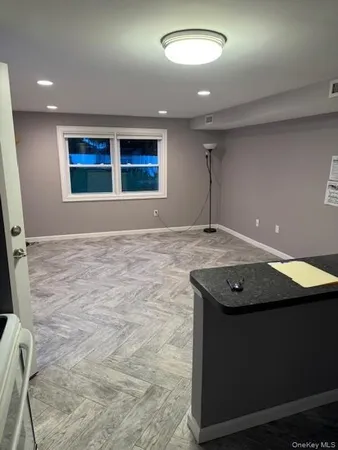 an empty room with a ceiling fan