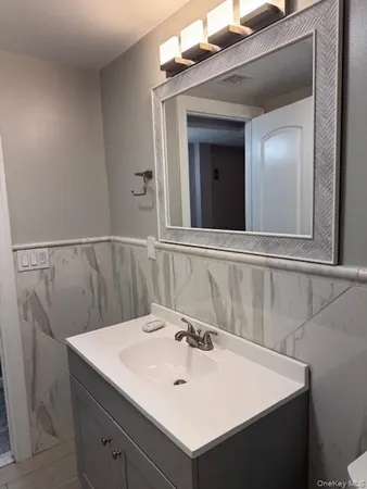 a bathroom with a sink and a mirror