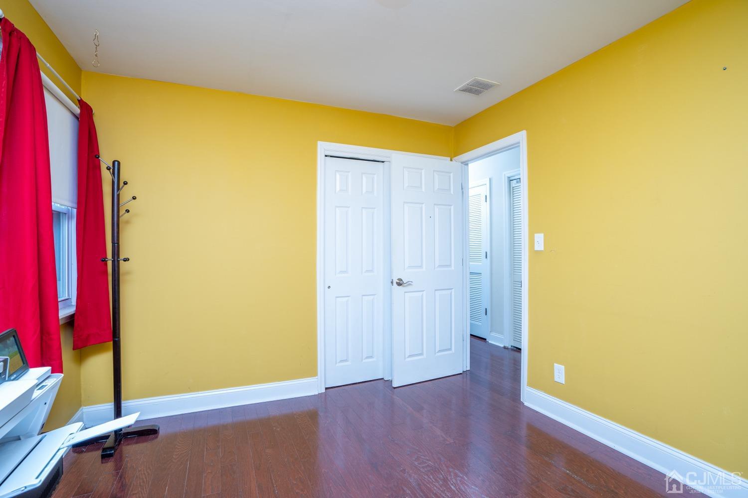 24 Kenmore Road Edison, NJ 08817 - Photo 12 of 21 a view of a room with wooden floor and bathroom