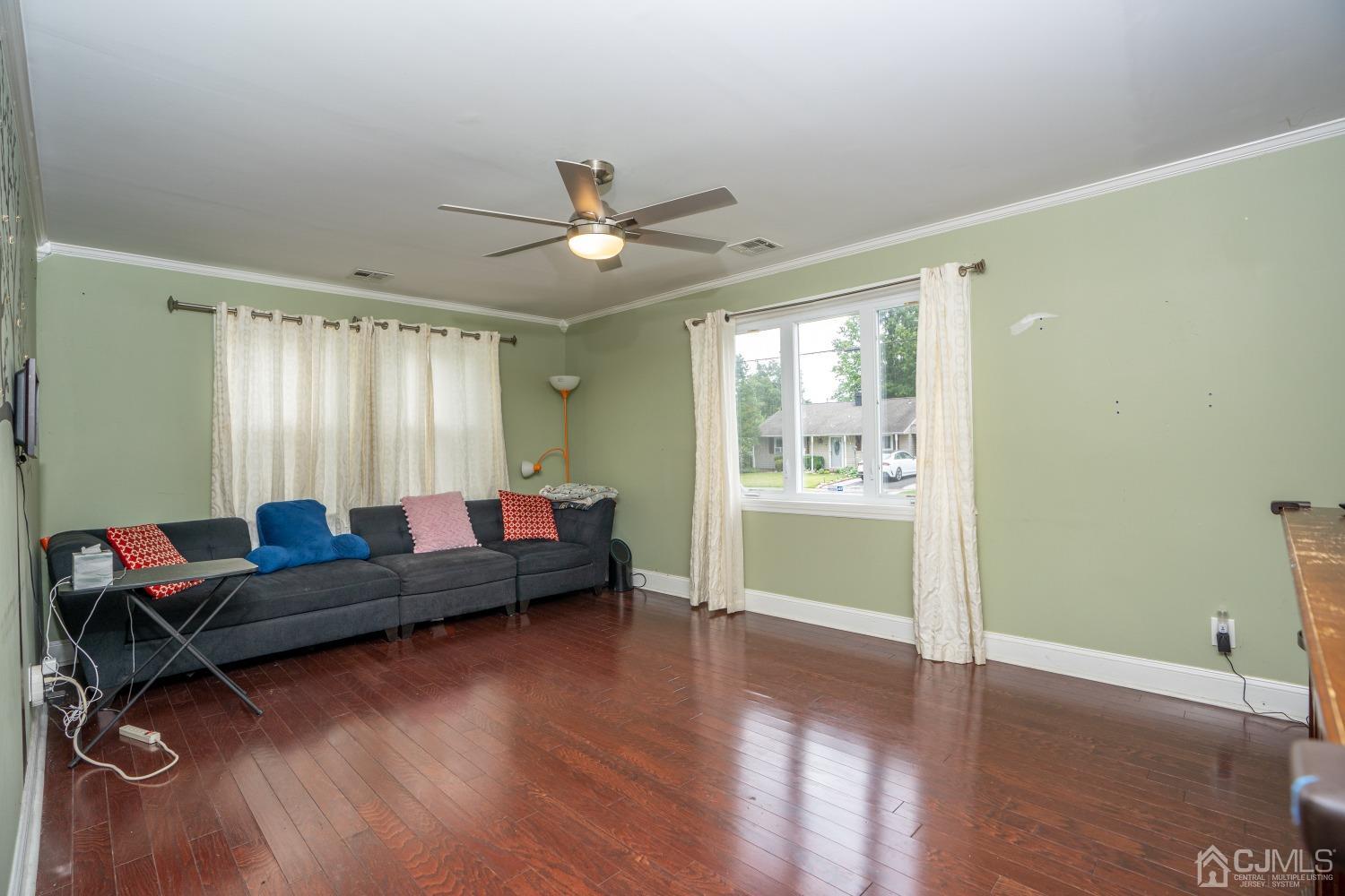 24 Kenmore Road Edison, NJ 08817 - Photo 14 of 21 a living room with furniture and a large window