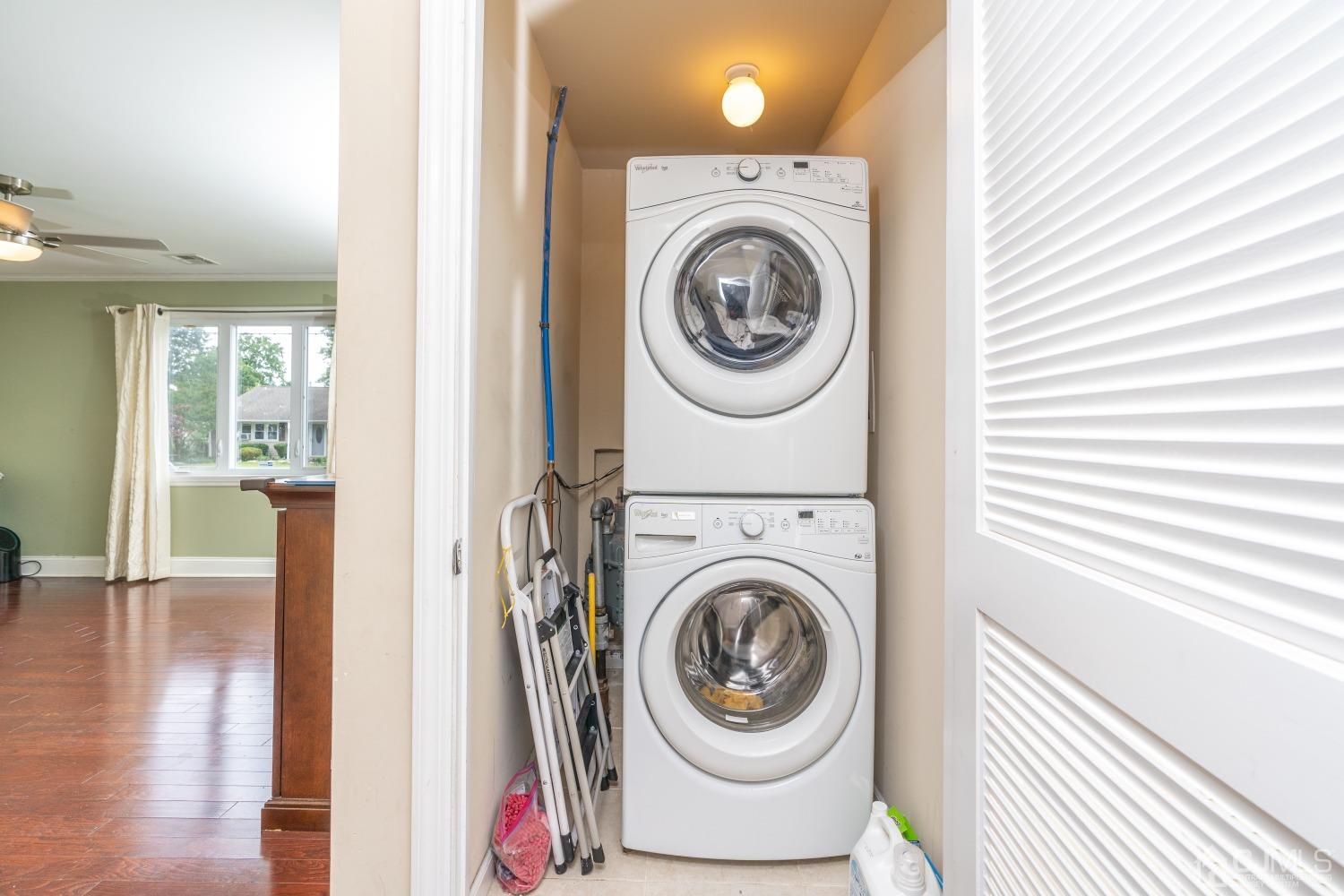 24 Kenmore Road Edison, NJ 08817 - Photo 15 of 21 a view of a hallway with washer and dryer