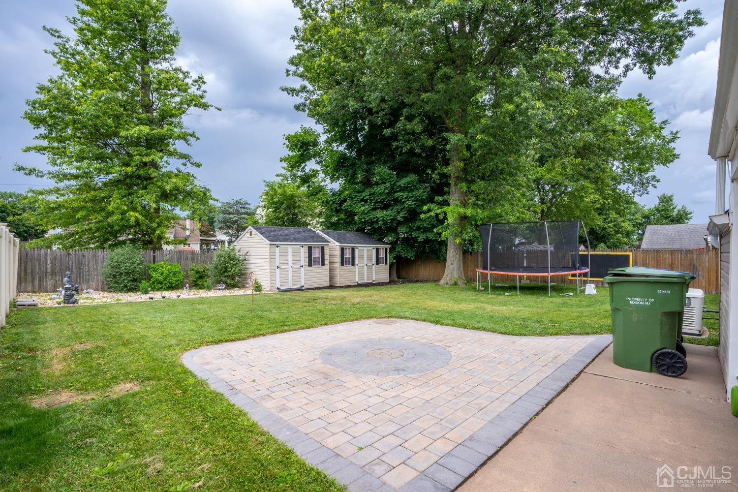 24 Kenmore Road Edison, NJ 08817 - Photo 18 of 21 front view of a house with a yard and a garden