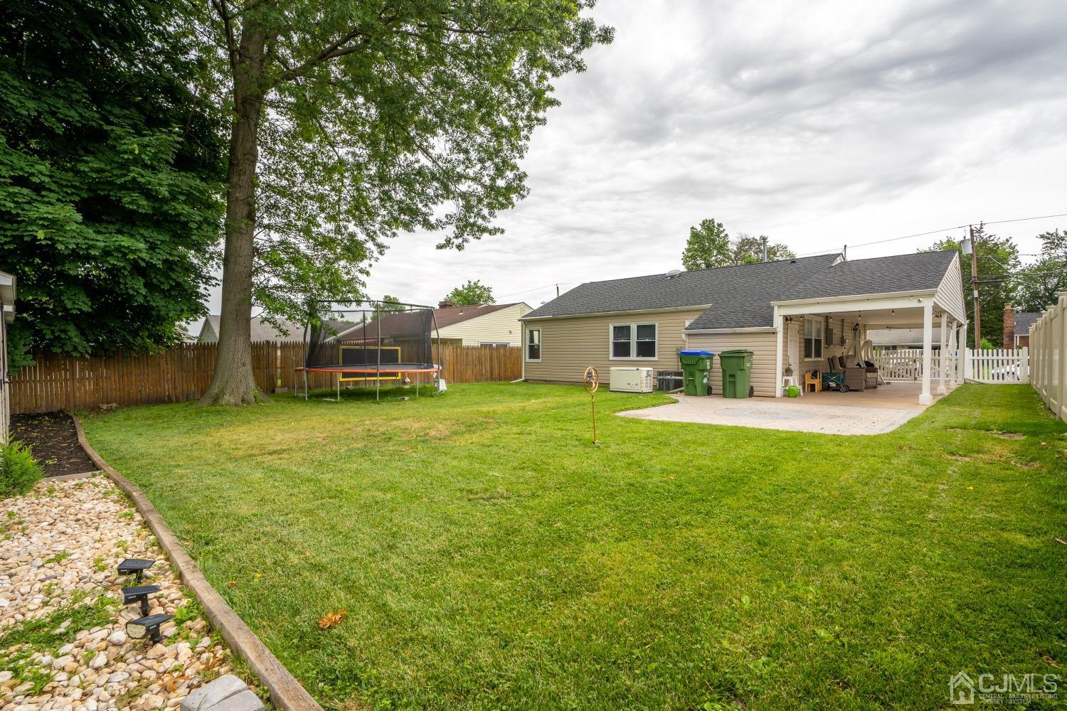 24 Kenmore Road Edison, NJ 08817 - Photo 20 of 21 front view of a house with a yard