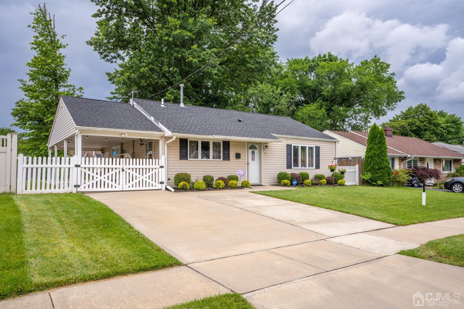 24 Kenmore Road Edison, NJ 08817 - Photo 2 of 21 a front view of a house with a garden and porch
