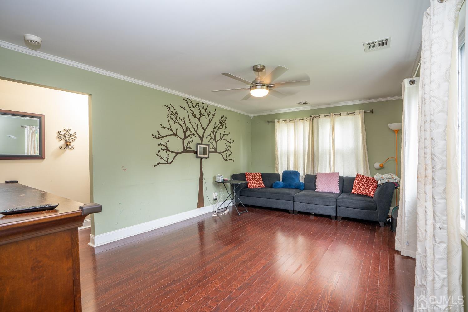 24 Kenmore Road Edison, NJ 08817 - Photo 5 of 21 a living room with furniture and a wooden floor