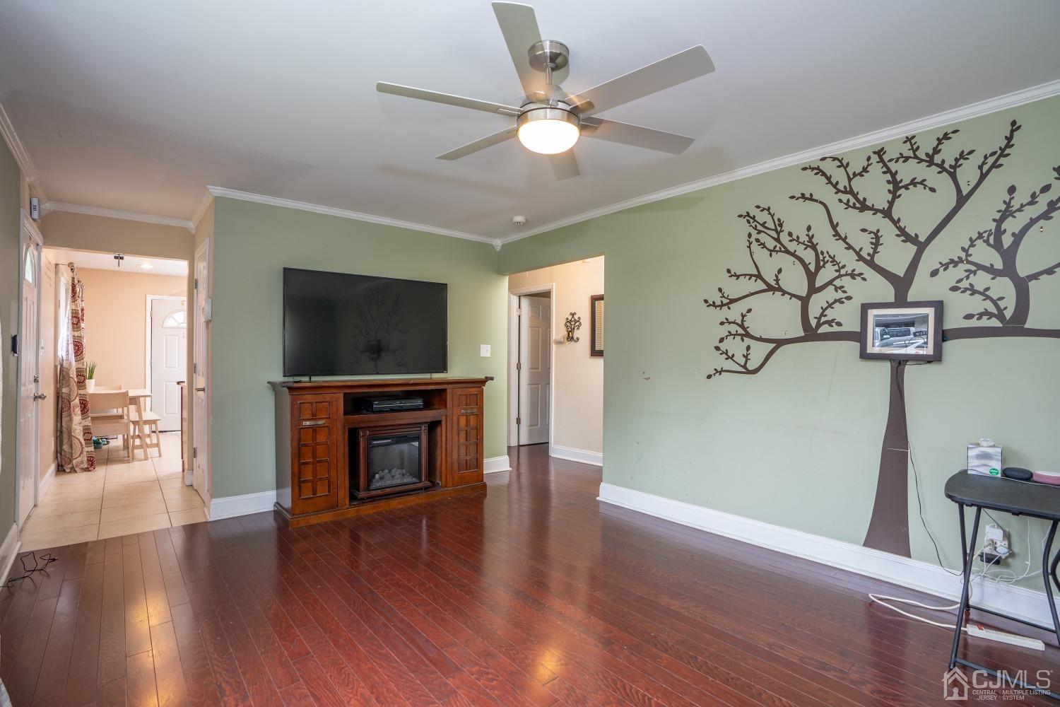 24 Kenmore Road Edison, NJ 08817 - Photo 6 of 21 a living room with furniture and a flat screen tv