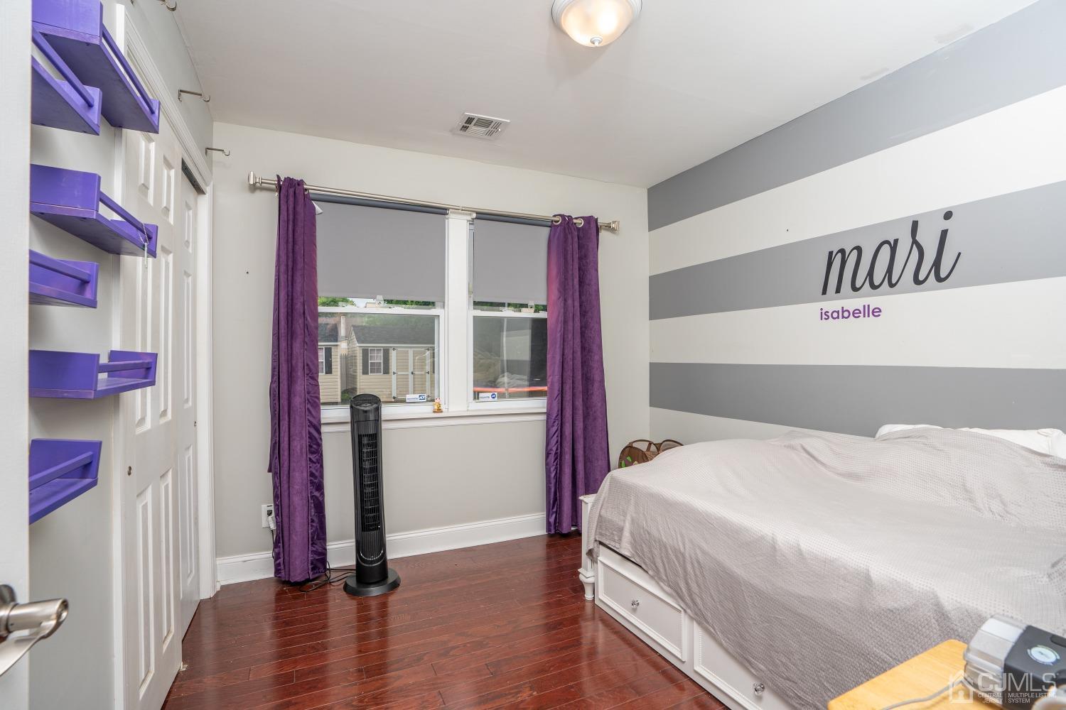 24 Kenmore Road Edison, NJ 08817 - Photo 9 of 21 a bedroom with a bed and wooden floor