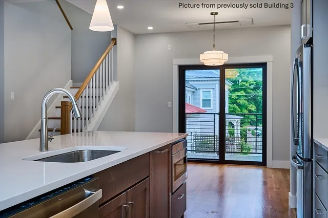 a kitchen with a table and chairs