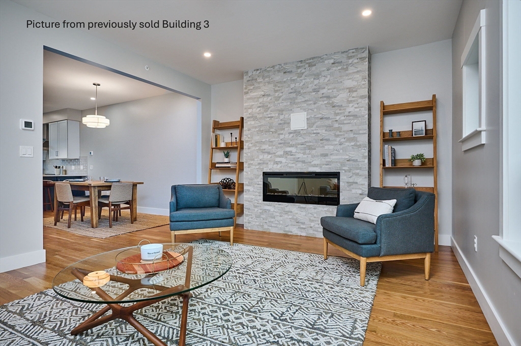 10 Hawley Street, Unit 4B Northampton, MA 01060 - Photo 3 of 23 a living room with furniture and a fireplace