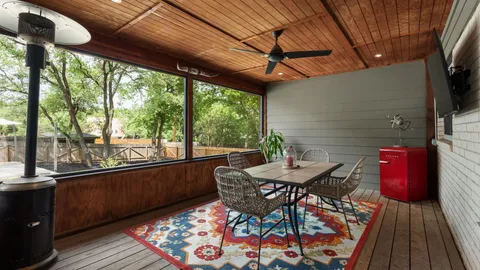 a view of a chairs and table in the balcony