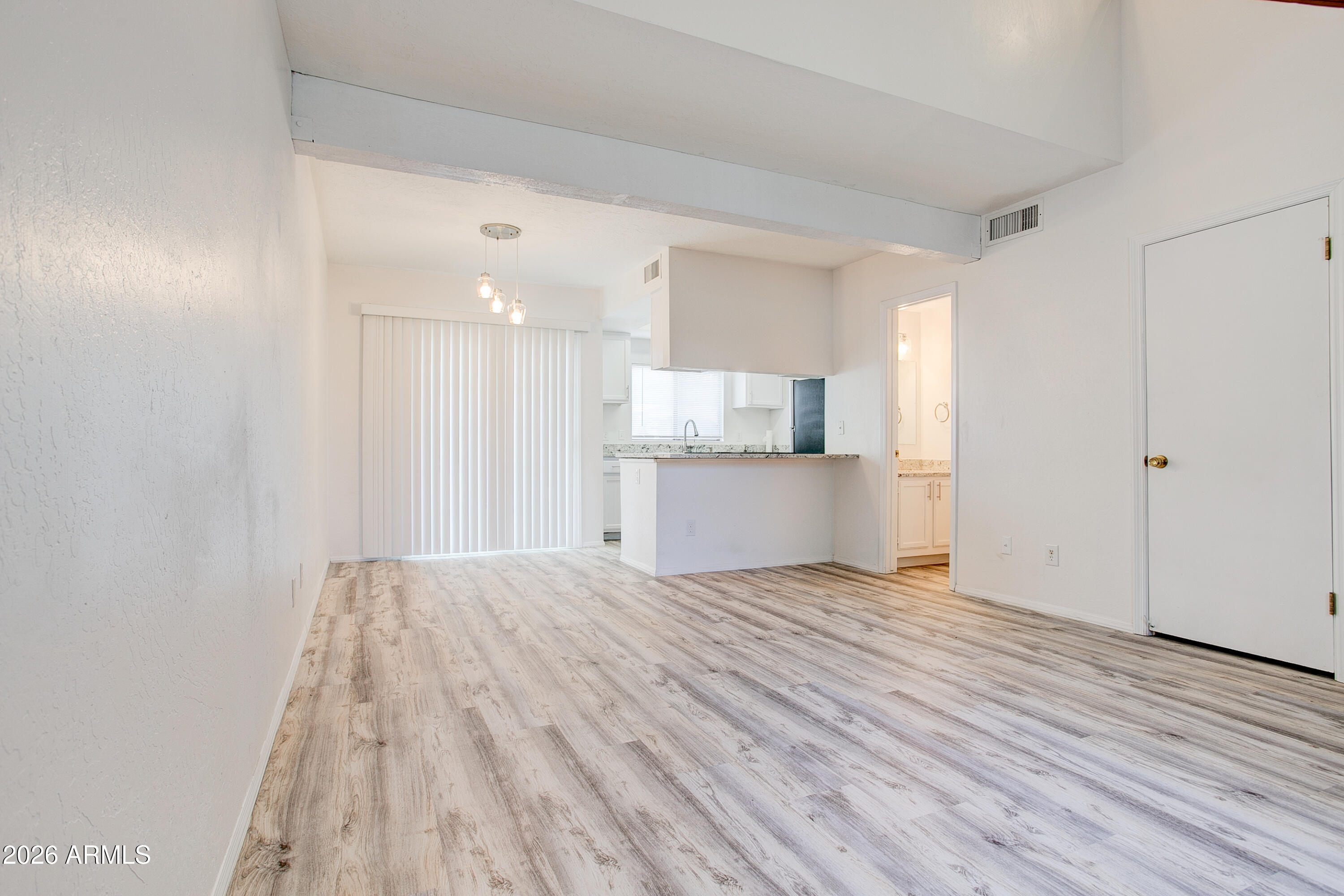 2215 West Augusta Avenue, Unit 102 Phoenix, AZ 85021 - Photo 18 of 39 a view of a kitchen with wooden floor and a sink