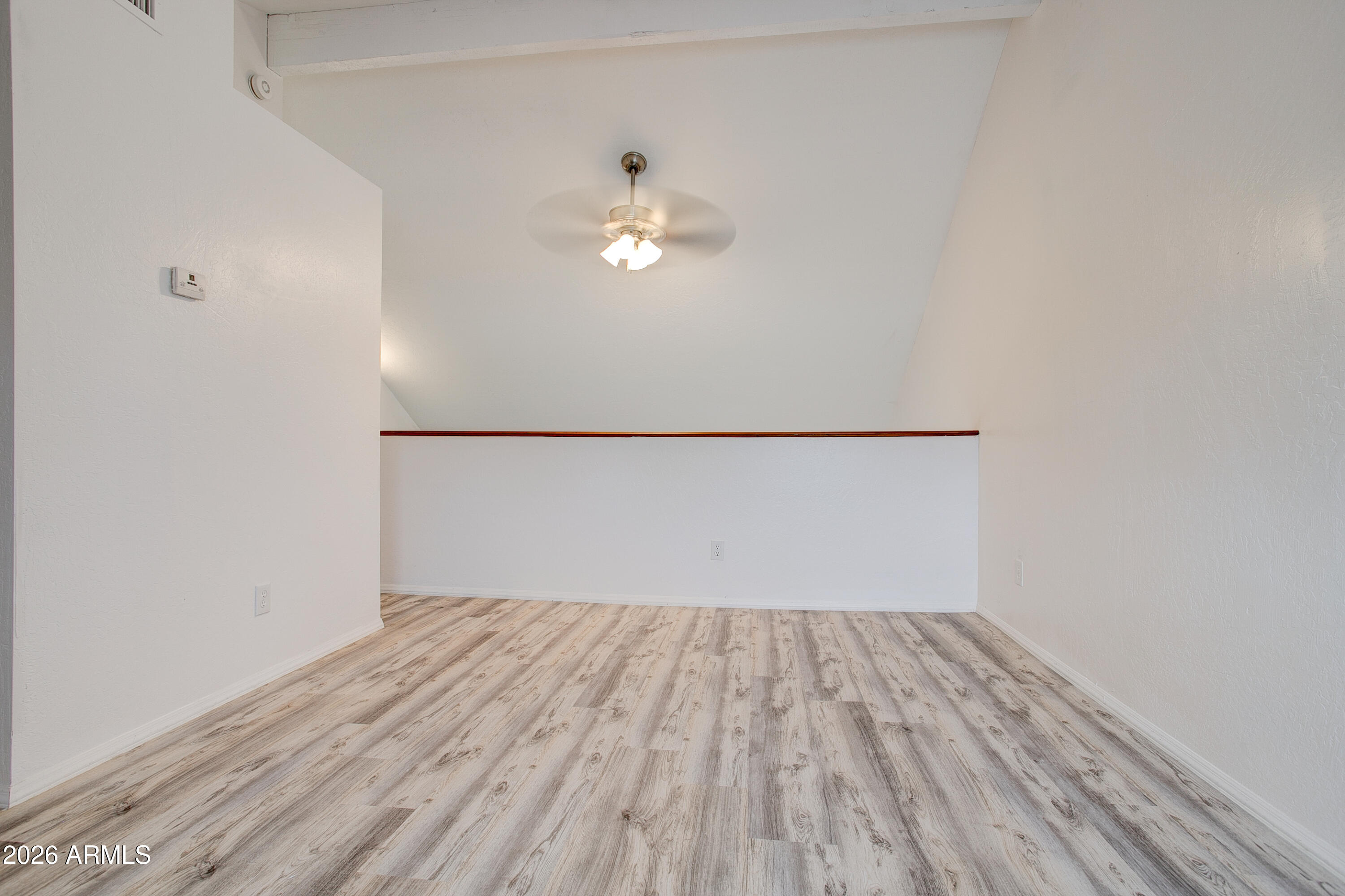2215 West Augusta Avenue, Unit 102 Phoenix, AZ 85021 - Photo 33 of 39 a view of empty room with wooden floor