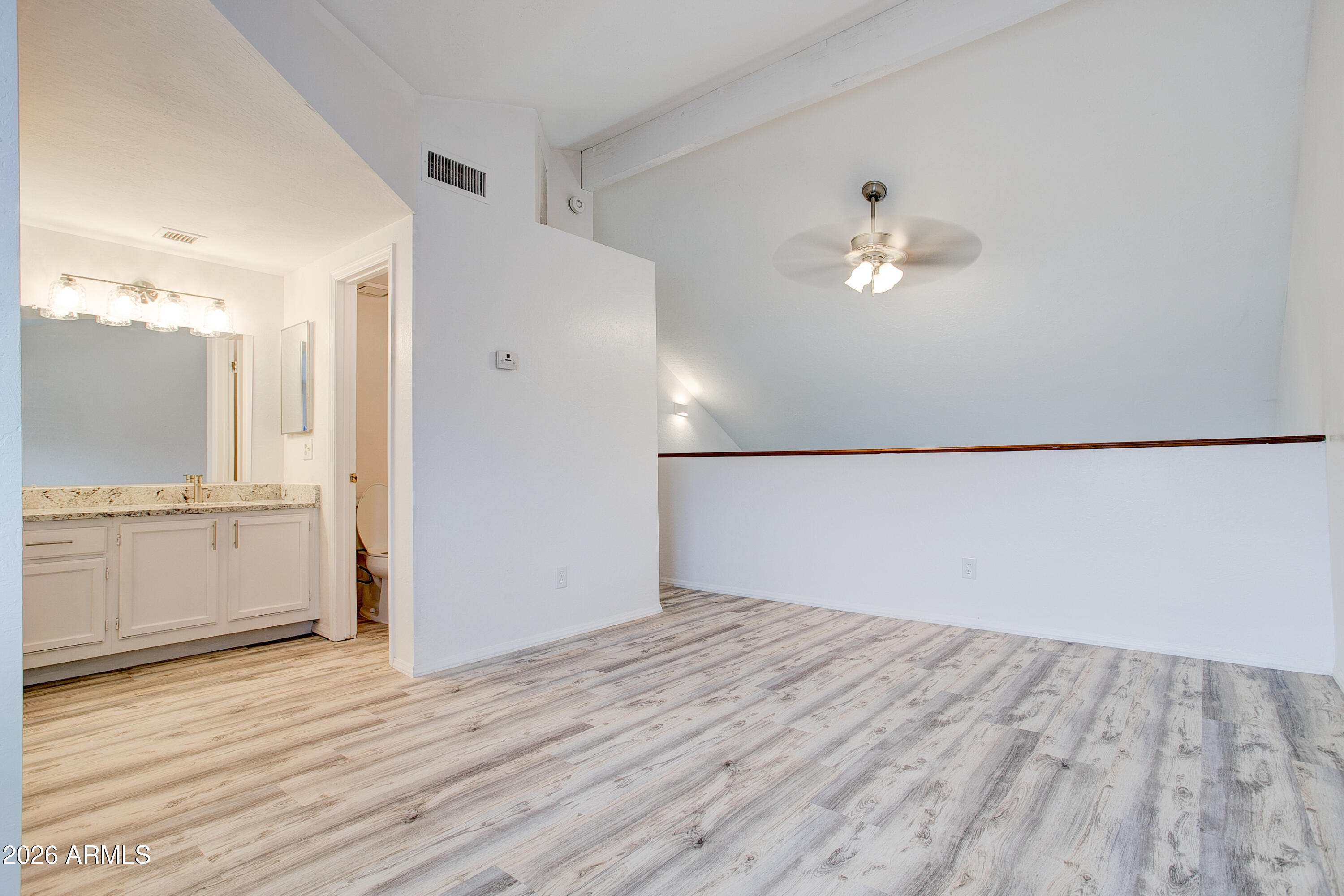 2215 West Augusta Avenue, Unit 102 Phoenix, AZ 85021 - Photo 36 of 39 wooden floor in an empty room with a window