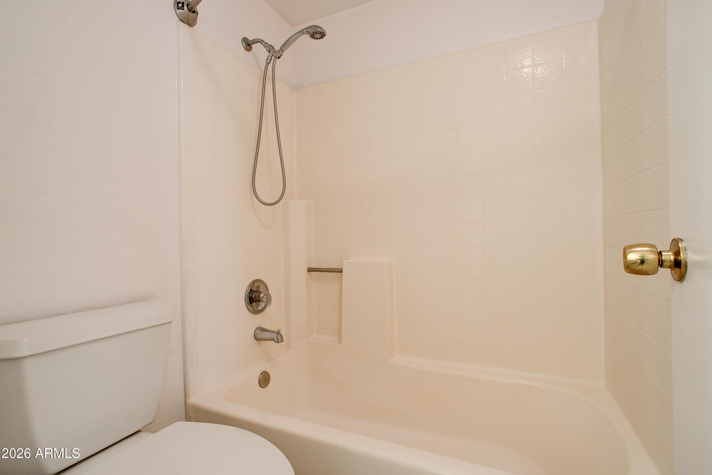 2215 West Augusta Avenue, Unit 102 Phoenix, AZ 85021 - Photo 38 of 39 a bathroom with a bath tub with a shower