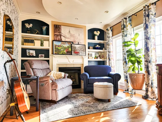 a living room with furniture and a fireplace