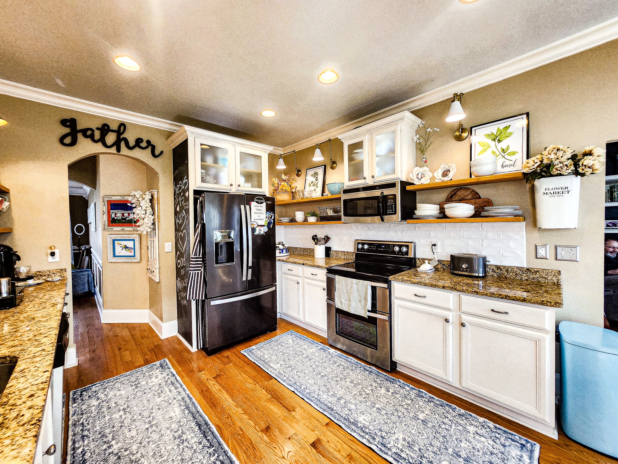 3003 Stow Crossing Murfreesboro, TN 37128 - Photo 6 of 9 a kitchen with stainless steel appliances granite countertop a refrigerator and a stove top oven