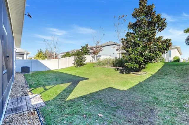 a view of a backyard with swimming pool