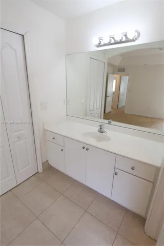 a bathroom with a sink and mirror