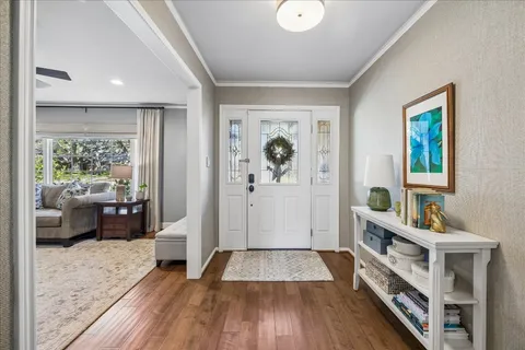 a bedroom with furniture and a wooden floor