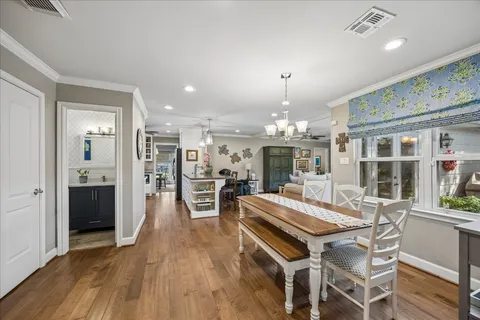 a view of a dining room kitchen with furniture and wooden floor