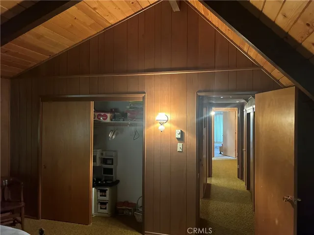 a bedroom with a bed and chair