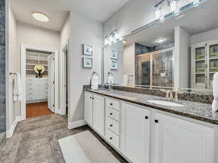 a living room with furniture a rug and a large window