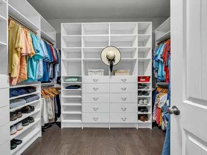 a bedroom with a bed and a table in it