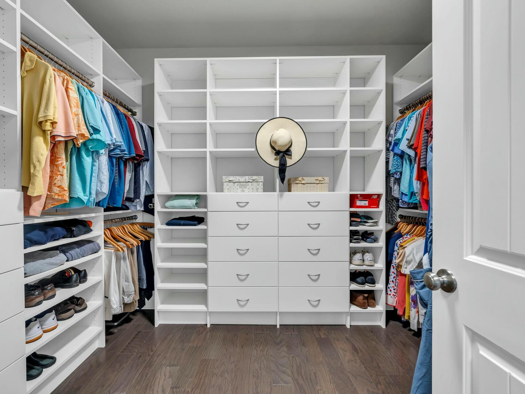 188 Ocean Spray Circle Santa Rosa Beach, FL 32459 - Photo 28 of 75 a view of walk in closet with clothes and shoes