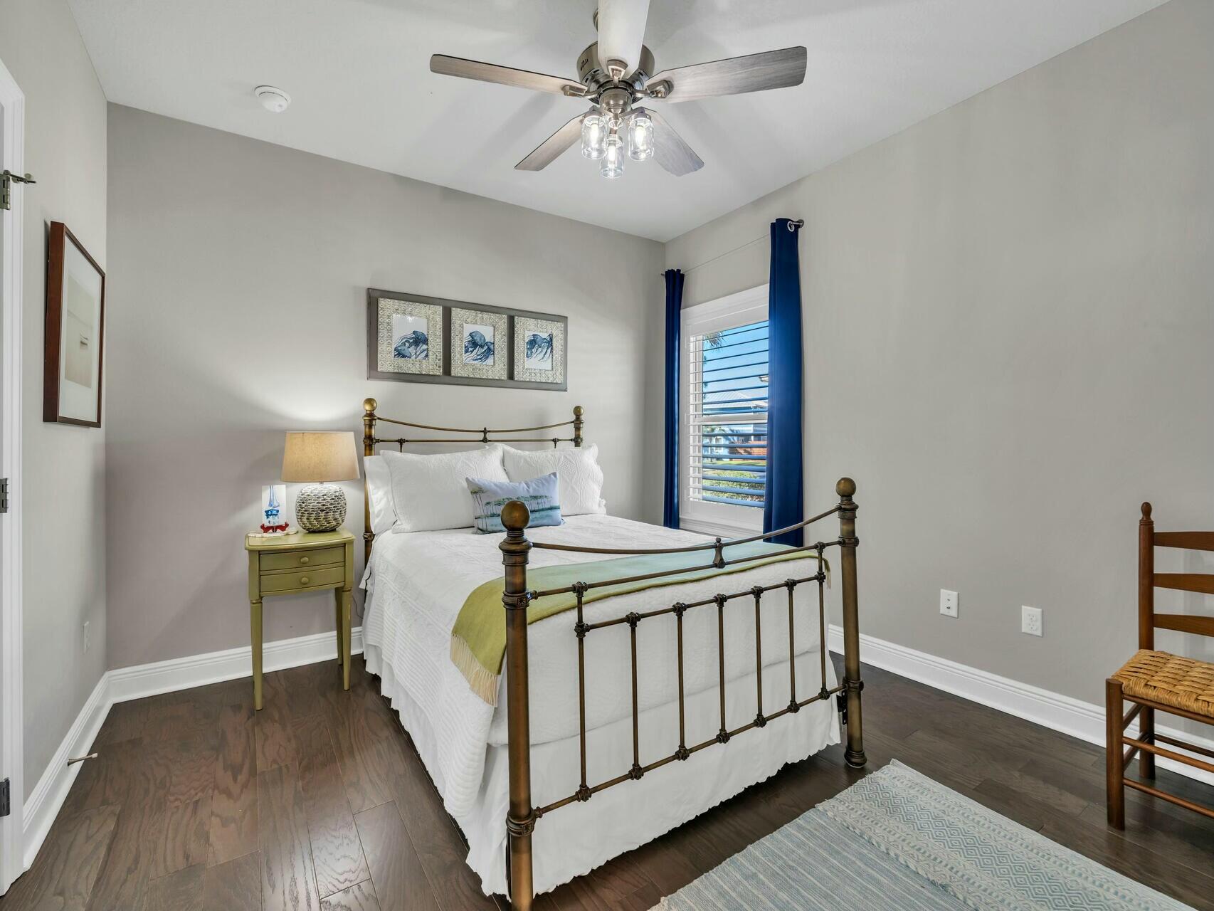 188 Ocean Spray Circle Santa Rosa Beach, FL 32459 - Photo 39 of 75 a bedroom with a bed and a table in it