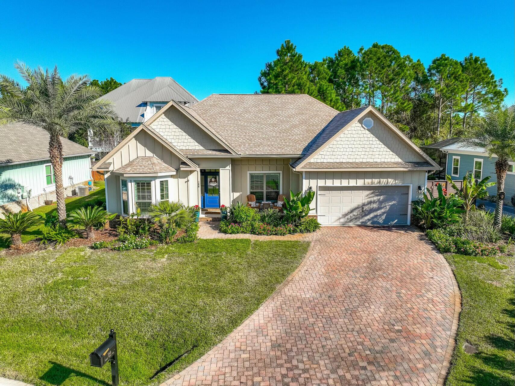 188 Ocean Spray Circle Santa Rosa Beach, FL 32459 - Photo 10 of 75 a front view of a house with a yard