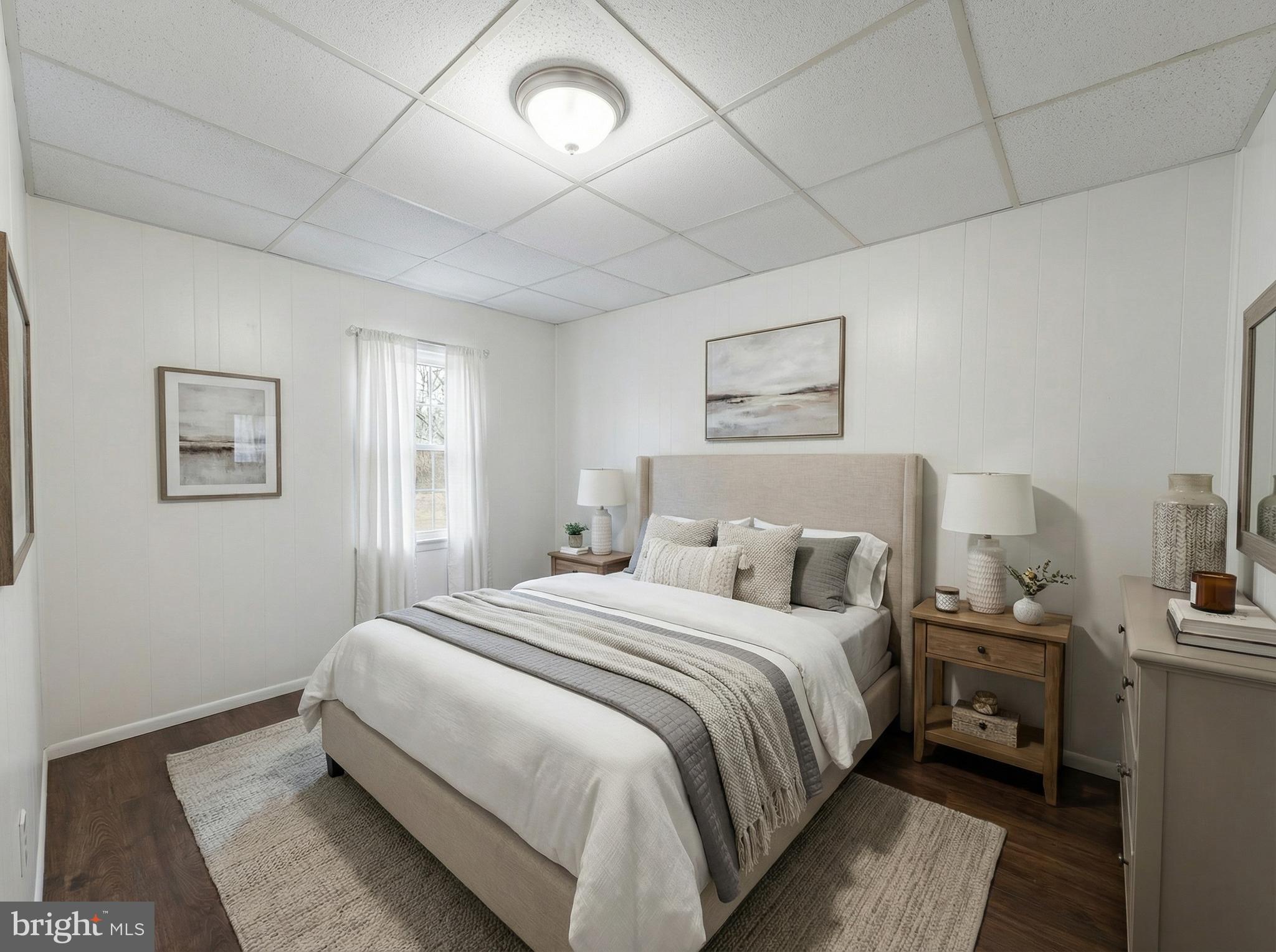 151 Arch Street York, PA 17401 - Photo 5 of 15 a bedroom with a bed and a night stand